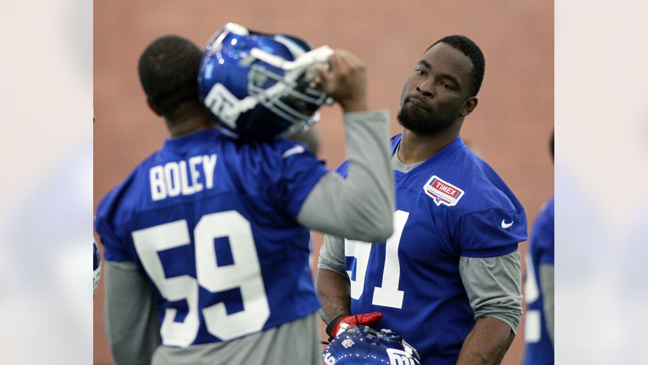 New York Giants defensive end Justin Tuck (91) during player introductions  before NFL action between the New York Giants and the Carolina Panthers at  New Meadowlands Stadium in East Rutherford, New Jersey.