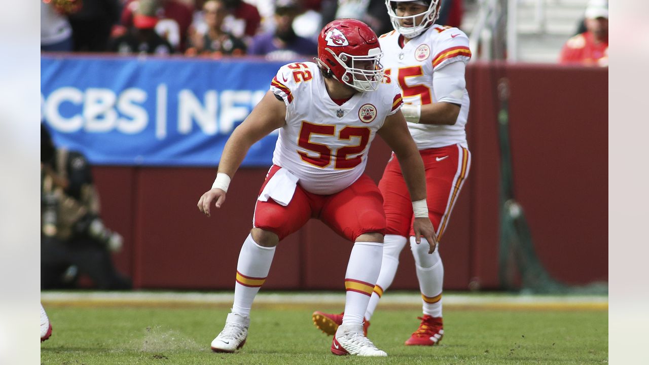 Kansas City Chiefs center Creed Humphrey (52) gets set on the line during  an NFL football