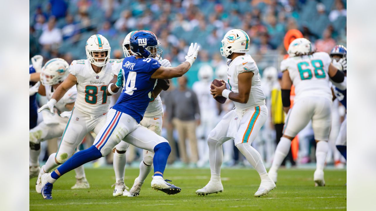 San Francisco 49ers' Sean Ryan (81) is tackled by Miami Dolphin's Channing  Crowder (52) after catching an 8 yard pass in third quarter action at  Dolphin Stadium in Miami on December 14