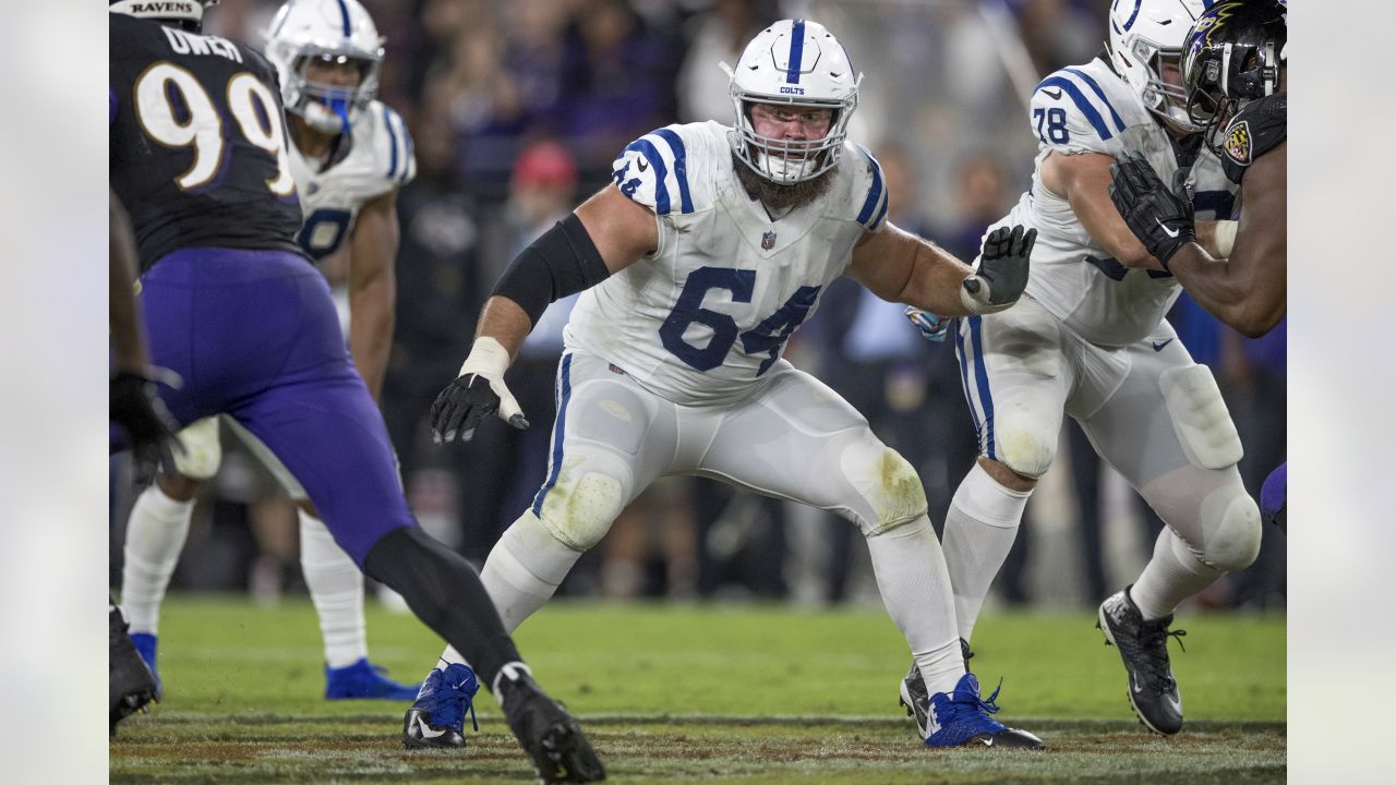 Indianapolis Colts guard Mark Glowinski (64) walks back to the huddle  during an NFL football game