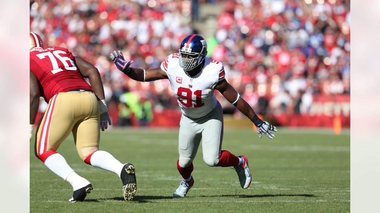 New York Giants defensive end Justin Tuck (91) pumps up the crowd during  second half NFL action in the New York Giants' 31-18 victory over the  Carolina Panthers at New Meadowlands Stadium