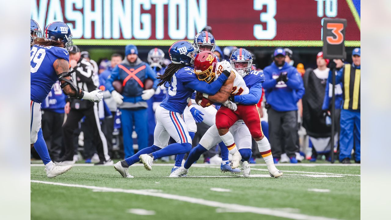 New York Giants fullback Elijhaa Penny (39) and defensive back Steven  Parker (38) react after a defensive play against the Washington Football  Team during the first quarter of an NFL football game, Sunday, Jan. 9,  2022, in East Rutherford, N.J. (AP Pho