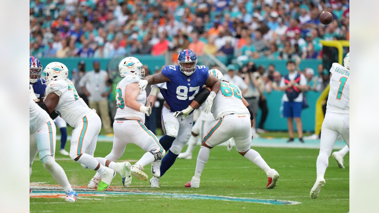 San Francisco 49ers' Sean Ryan (81) is tackled by Miami Dolphin's Channing  Crowder (52) after catching an 8 yard pass in third quarter action at  Dolphin Stadium in Miami on December 14