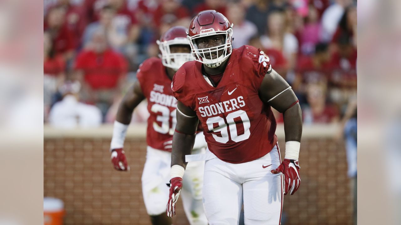 Oklahoma defensive lineman Neville Gallimore (90) tackles LSU quarterback  Joe Burrow (9during t …