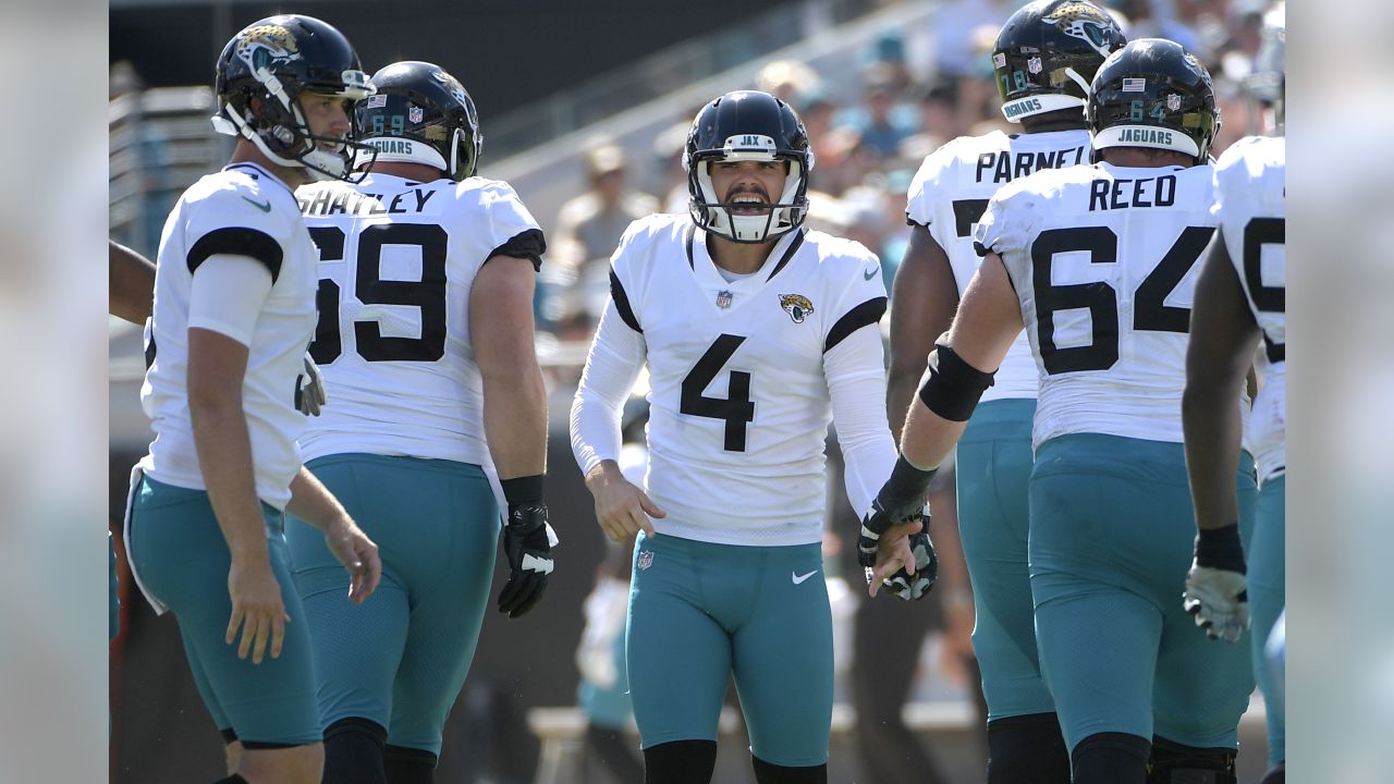 Jacksonville Jaguars kicker Josh Lambo (4) celebrates with Calais Campbell  (93) after kicking a field goal during the second half of an NFL divisional  football AFC playoff game against the Pittsbu …