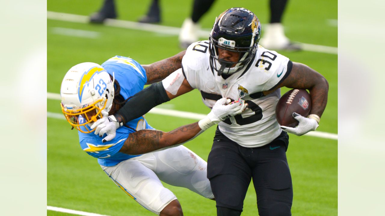 JACKSONVILLE, FL - NOVEMBER 28: Jacksonville Jaguars running back James  Robinson (25) runs with the ball during the game between the Atlanta  Falcons and the Jacksonville Jaguars on November 28, 2021 at