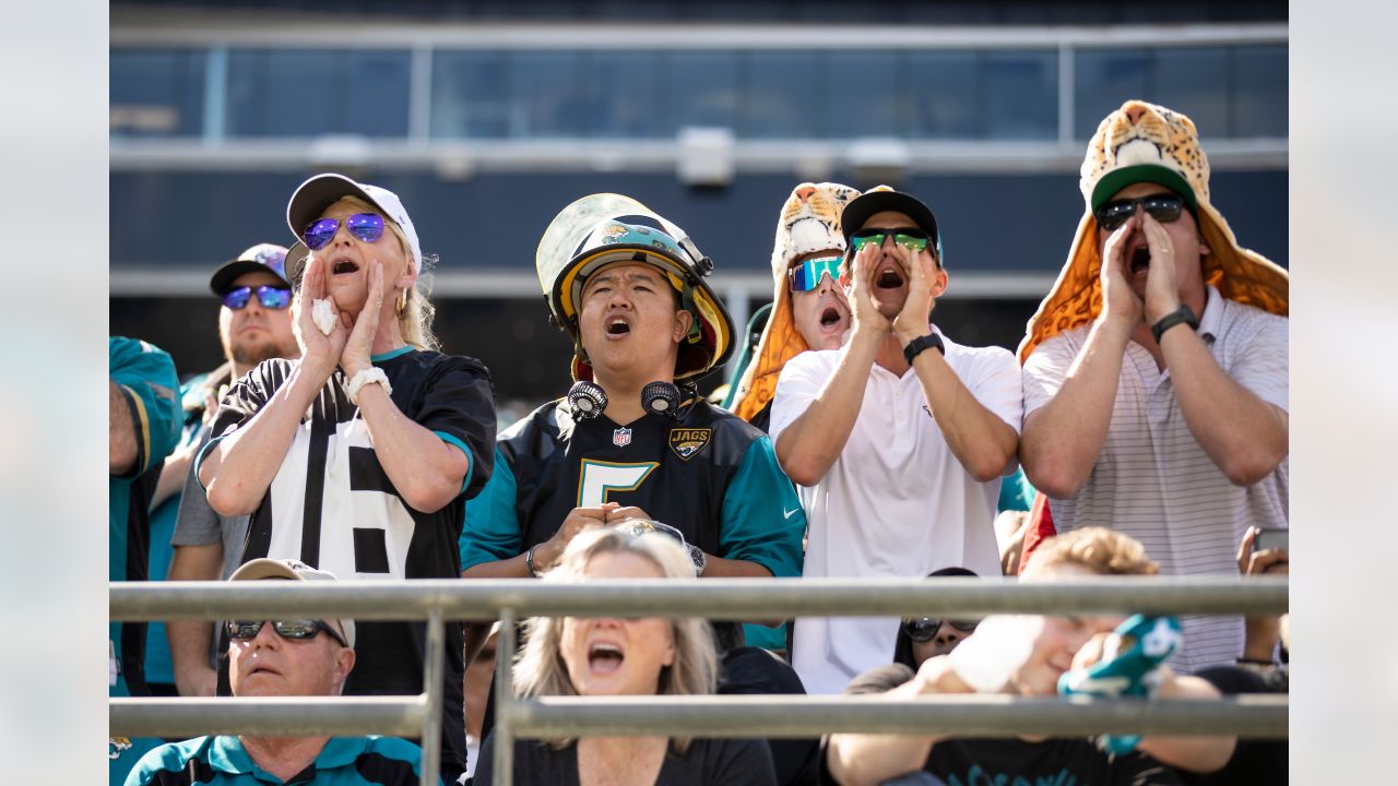 Jacksonville Jaguars fans pose for photos outside the stadium