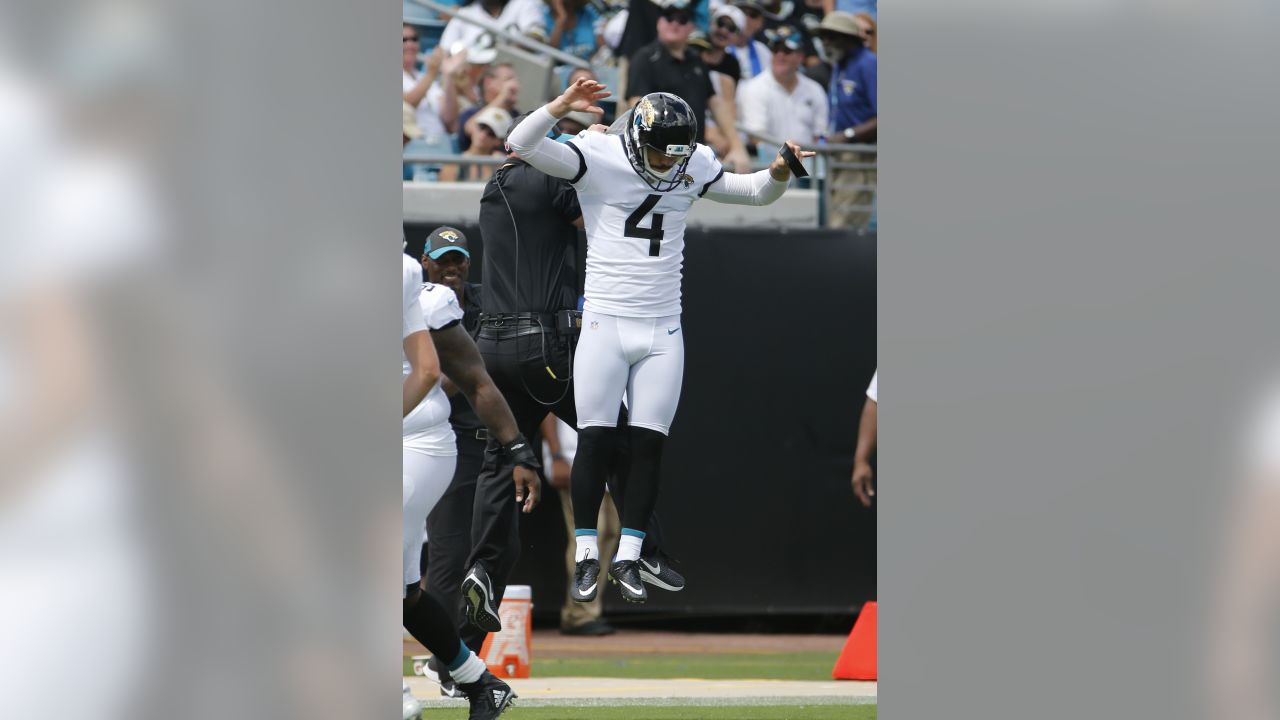 Jacksonville Jaguars place kicker Josh Lambo, right, and holder Logan Cooke  (9) watch the flight of the ball after Lambo kicked a field goal during the  second half of an NFL football