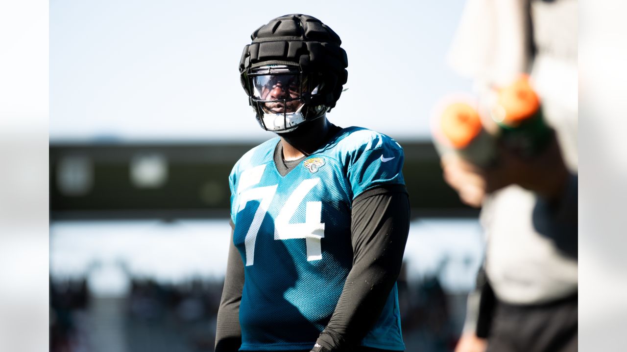 Jacksonville Jaguars offensive tackle Anton Harrison (76) puts on his helmet  before a drill during an NFL football practice, Monday, June 12, 2023, in  Jacksonville, Fla. (AP Photo/John Raoux Stock Photo - Alamy