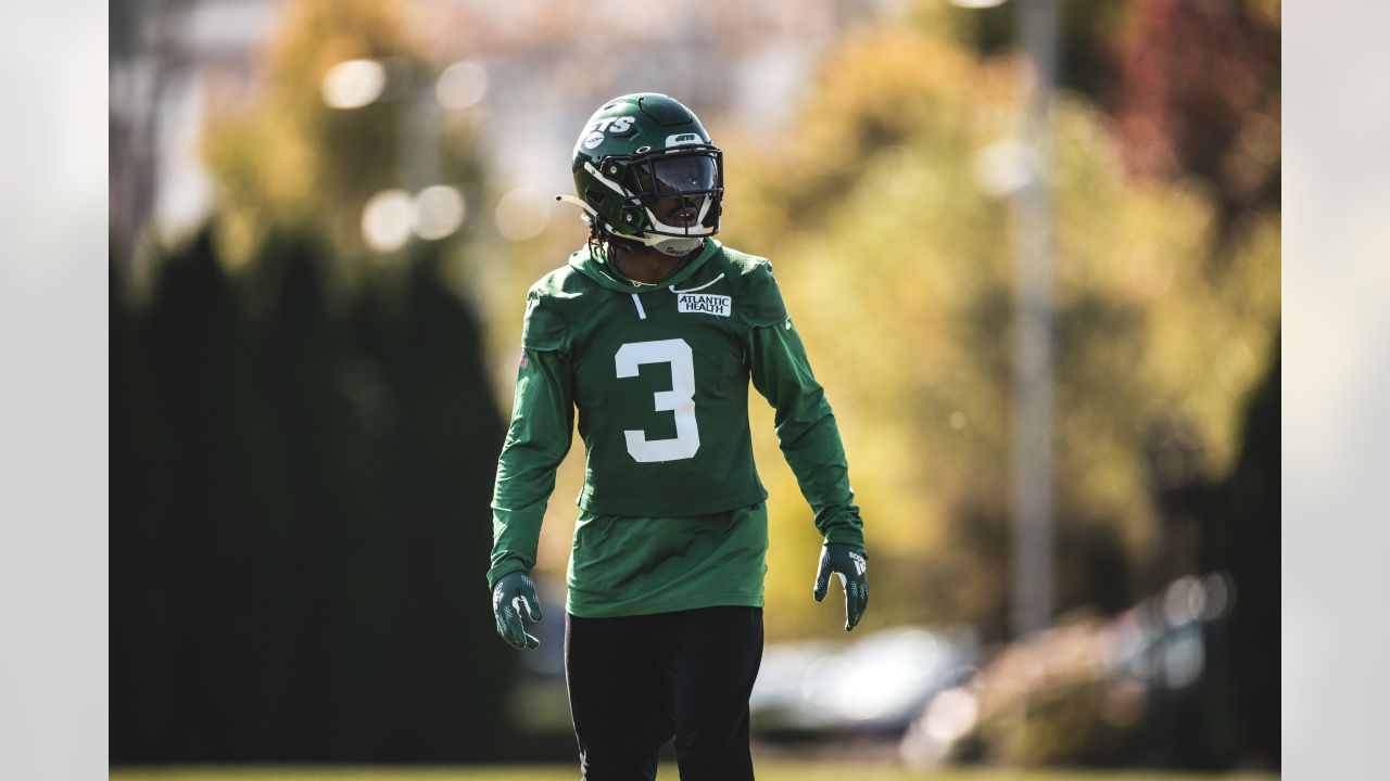 New York Jets guard Nate Herbig (65) walks to the line of