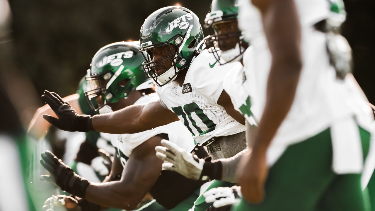 Wrestlers grapple with football at Jets camp