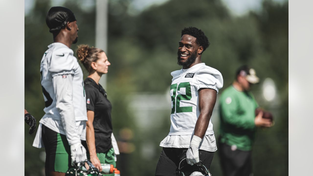 New York Jets' Michael Carter, left, runs the ball during the first half of  an NFL football game against the Cincinnati Bengals, Sunday, Oct. 31, 2021,  in East Rutherford, N.J. (AP Photo/Noah