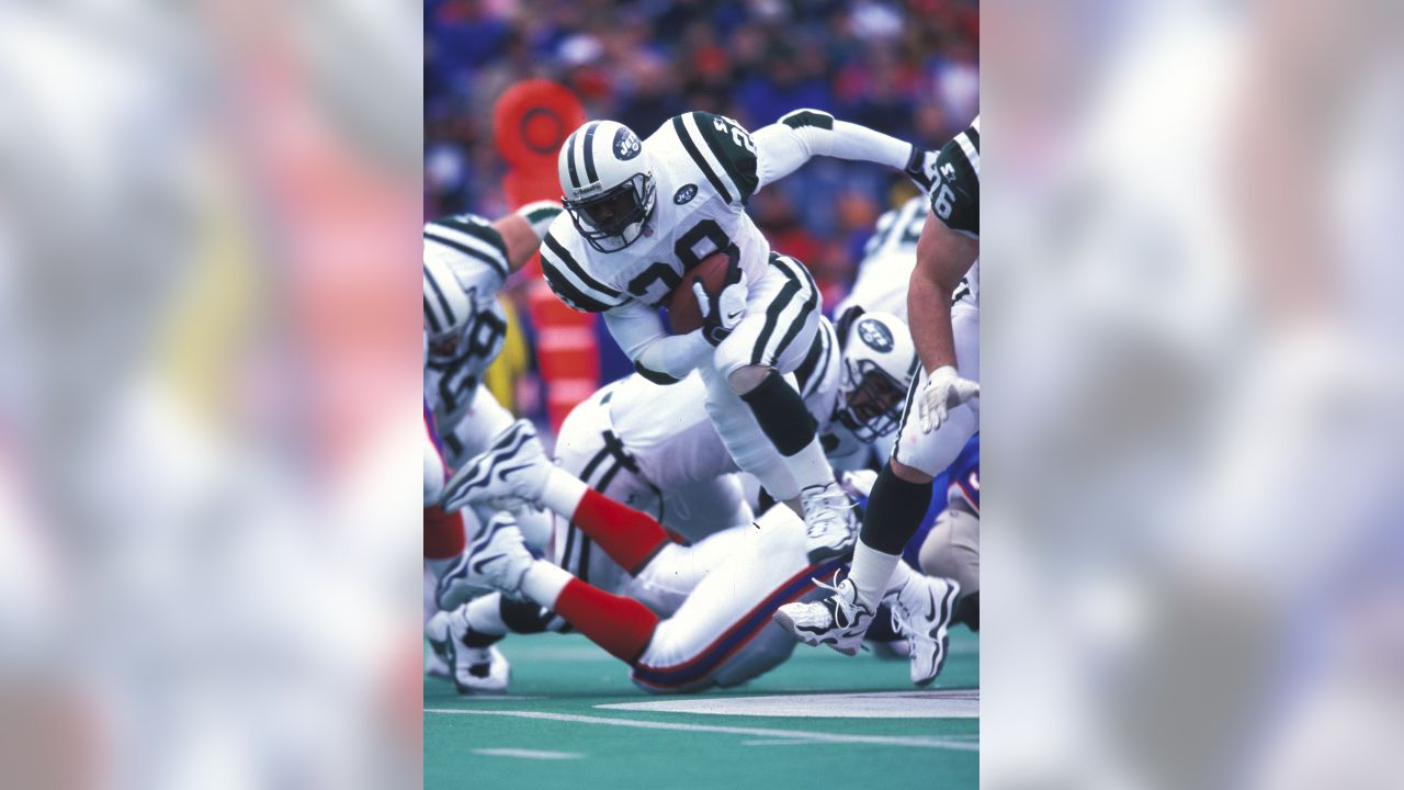 Detroit Lions running back Kevin Jones, (34) breaks away from Buffalo Bills  linebacker Angelo Crowell for a 7-yard touchdown in the first quarter of  their NFL football game in Detroit, Sunday, Oct.