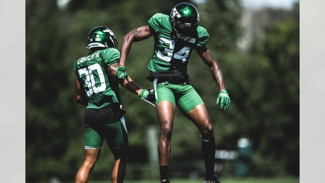 New York Jets cornerback Lamar Jackson (38) wears a shirt with a Crucial  Catch patch as he warms up on the field before taking on the Miami Dolphins  during an NFL football