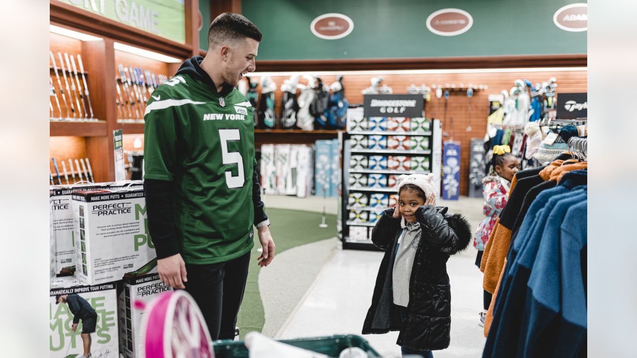 Kids go on a shopping spree with Denver Broncos players