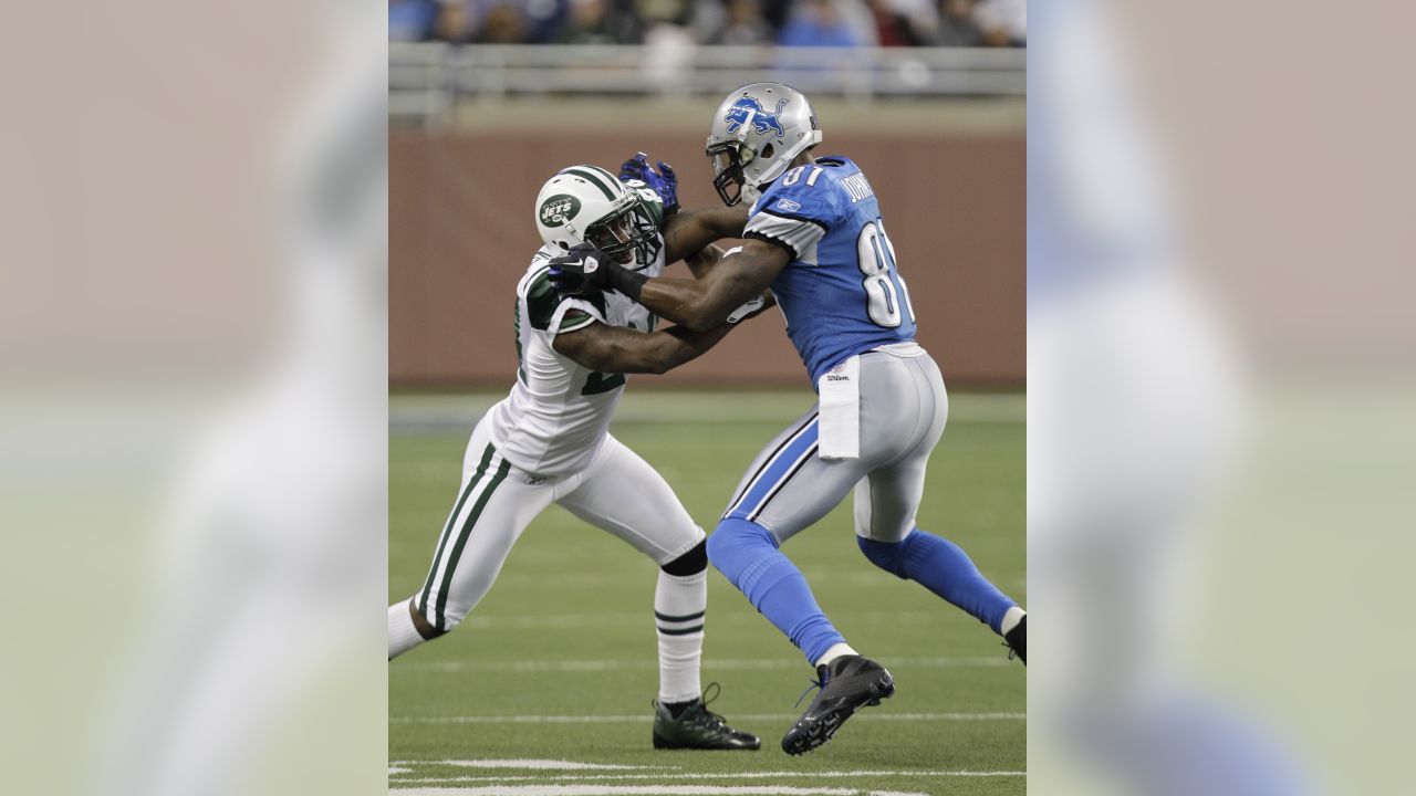 Cincinnati Bengals wide receiver Chad Johnson (85) gets tackled by Detroit  Lions cornerback Dre' Bly (32) in the first quarter December 18, 2005 at  Ford Field in Detroit. The Bengals defeated the