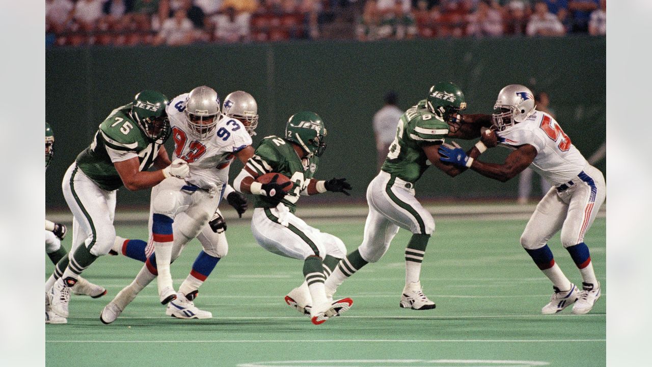 New England Patriots running back Corey Dillon gains yards against the New  York Jets at Gillette