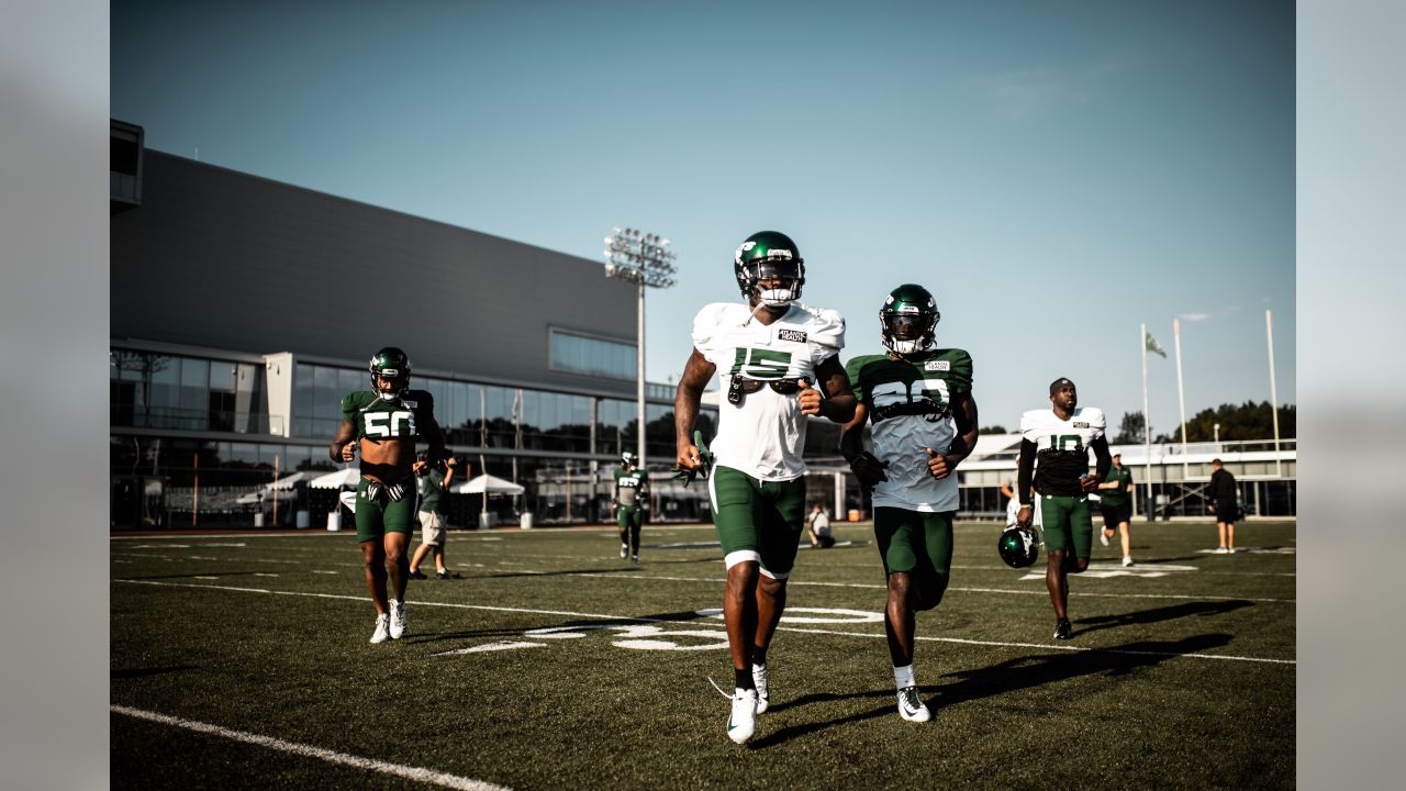 Wrestlers grapple with football at Jets camp