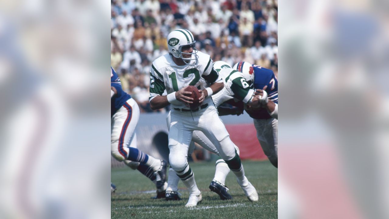 New York Jets quarterback Joe Namath, (12), gets the pass off down