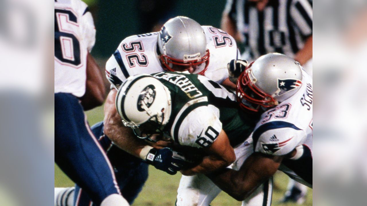 New York Jets Al Toon, dark jersey, is tackled by New England Patriots Fred  Marion, left, and Ernest Gibson during first quarter action at Sullivan  Stadium, Foxboro, Mass., Oct. 12, 1986. (AP