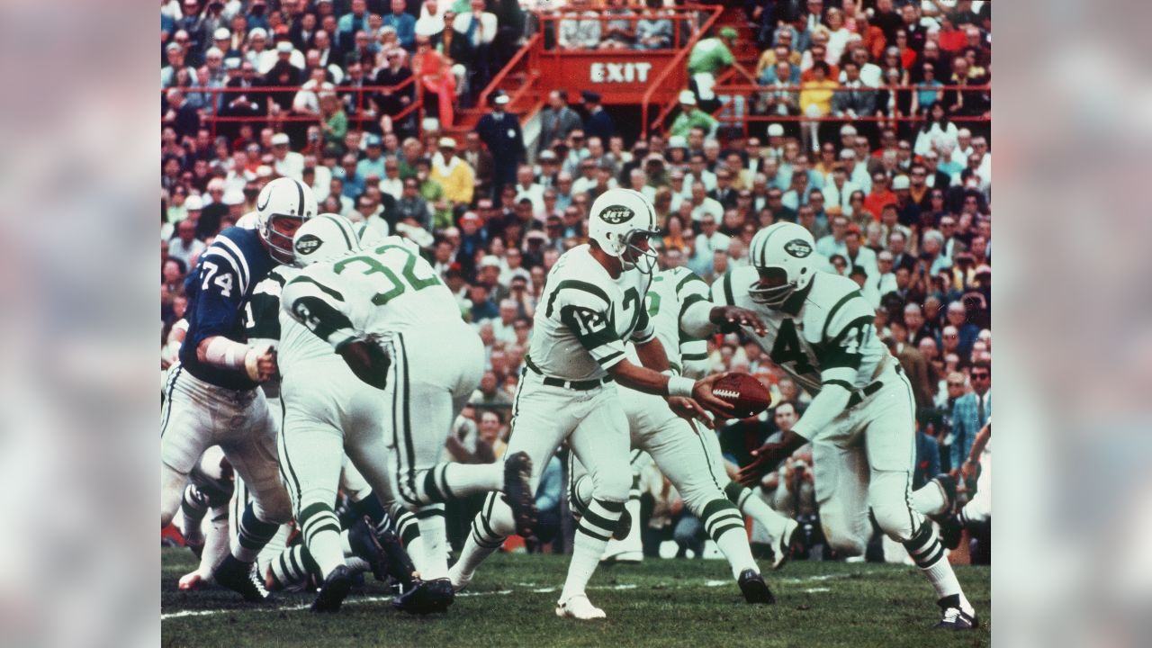 New York Jets quarterback Joe Namath, (12), gets the pass off down