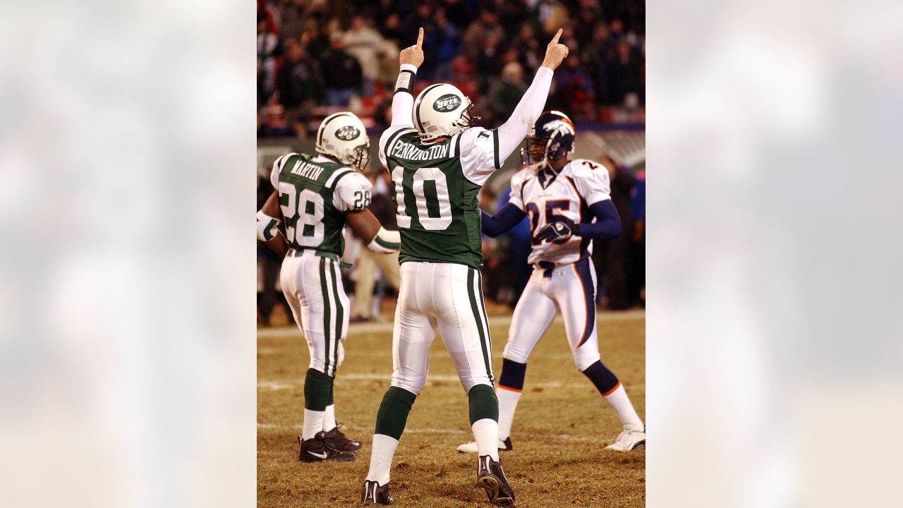 New Jets quarterback Chad Pennington (10) hands off to running back Curtis  Martin (28) against the Miami Dolphins October 3 2004 at Pro Player Stadium  in Miami Fl. The New York Jets