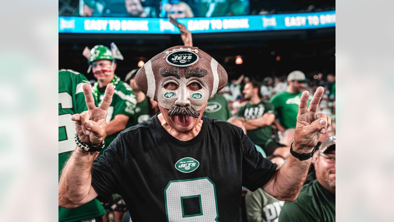 New York Jets fans dress for Halloween before a game against the