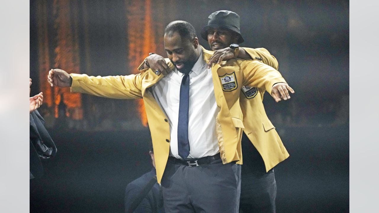 A teary-eyed Terrell Davis receives his gold jacket. “I'm a Hall of Famer  now.” – The Denver Post