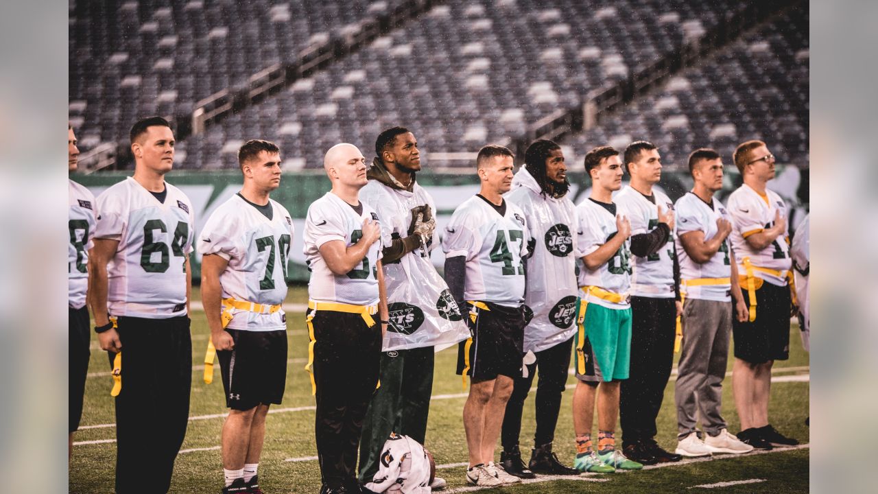 File:Service members unfurl flag at NY Jets first home game at new