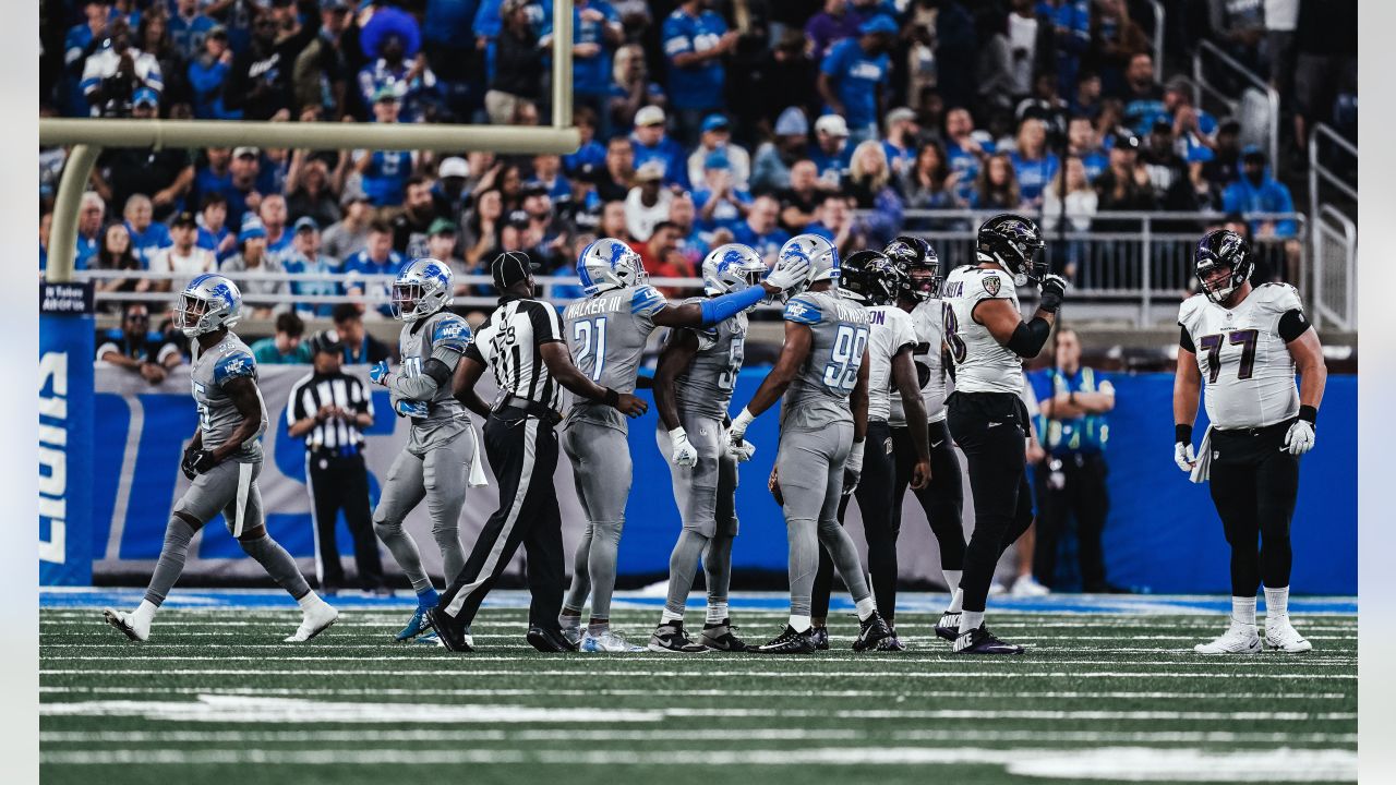 DETROIT, MI - SEPTEMBER 26: Baltimore Ravens quarterback Lamar Jackson (8)  gets sacked by Detroit Lions linebacker Alex Anzalone (34) in the fourth  quarter during NFL game between Baltimore Ravens and Detroit