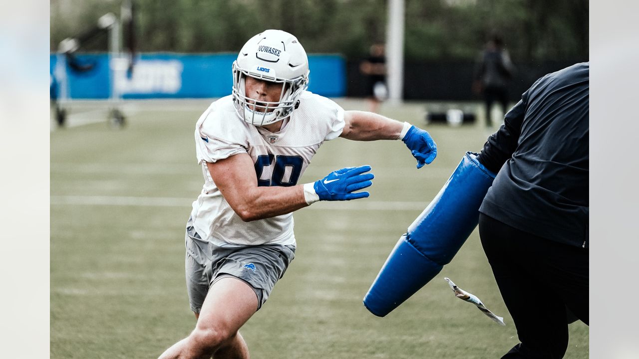 Detroit Lions linebacker Trevor Nowaske runs a drill during an NFL