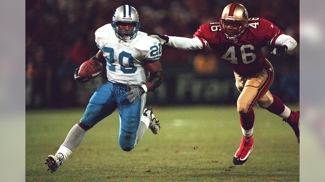 FILE - San Francisco 49ers quarterback Steve Young upends Dallas