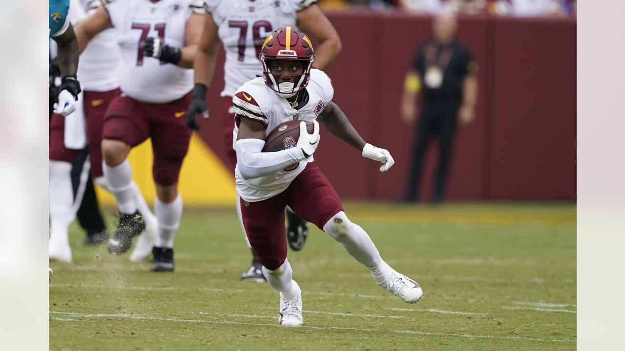 Washington Commanders wide receiver Curtis Samuel (10) gestures