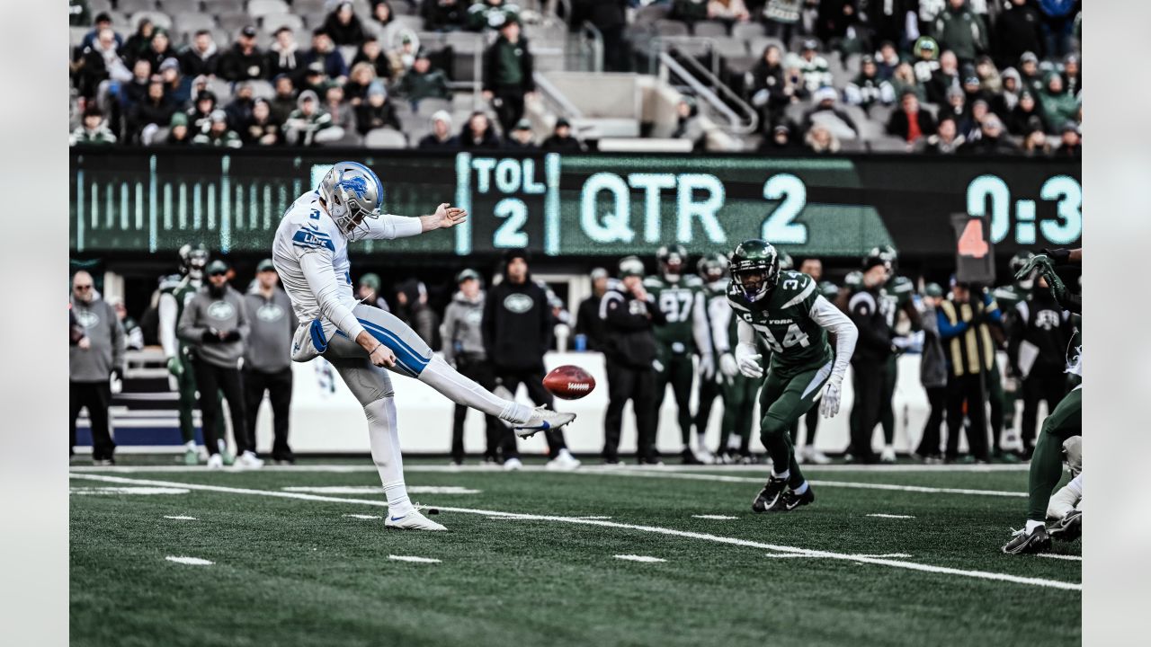 Detroit Lions punter Jack Fox (3) punts against the Seattle