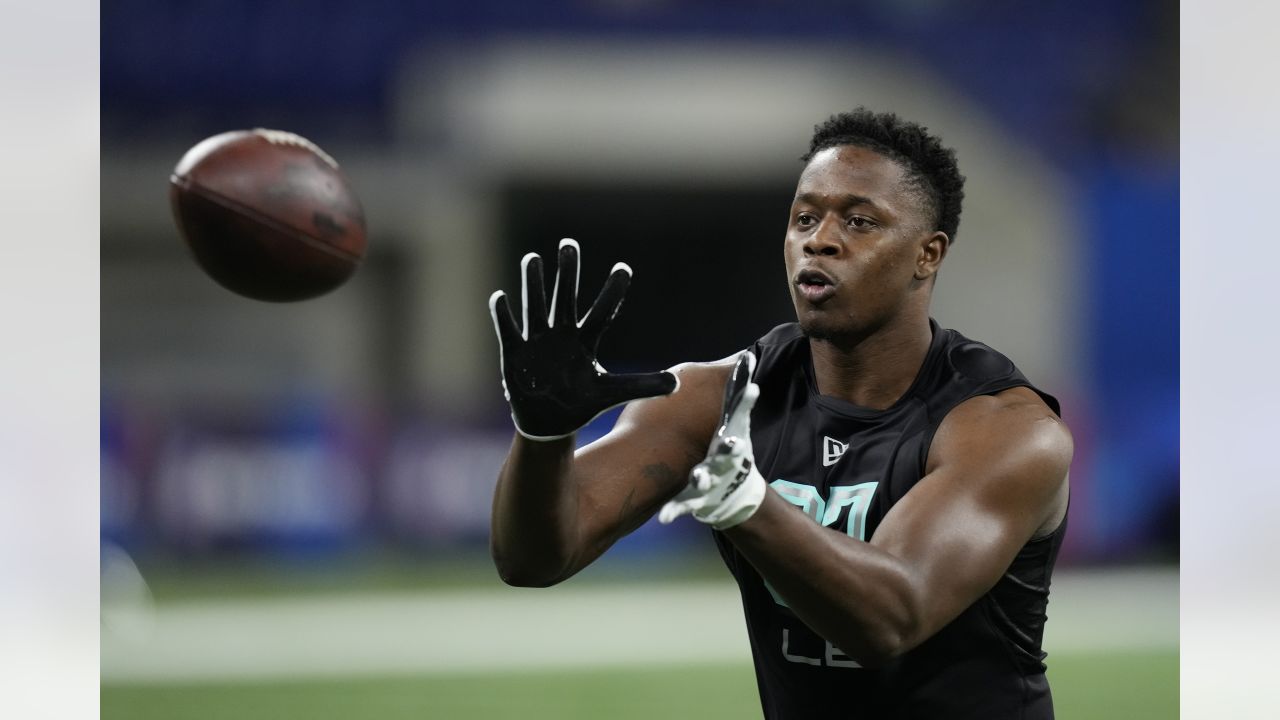 Utah linebacker Devin Lloyd runs a drill at the NFL football