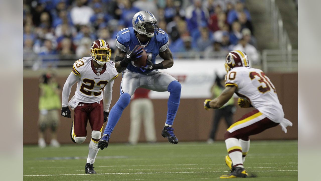 FILE - In this Jan. 12, 1992, file photo, Detroit Lions running back Barry  Sanders, left, looks for room to run against the Washington Redskins during  the second quarter of the NFC championship NFL football game at RFK Stadium  in Washington. Sanders wi