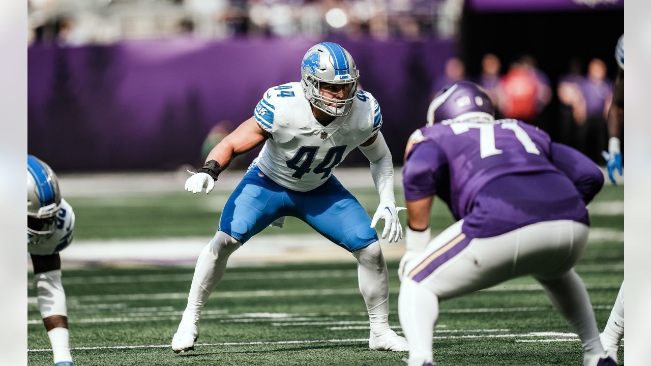 Detroit Lions linebacker Levy stands atop a plane