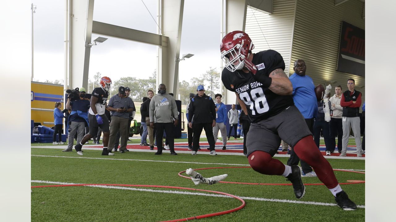 American Team defensive lineman DeAngelo Malone of Western Kentucky (10)  runs through drills during practice for