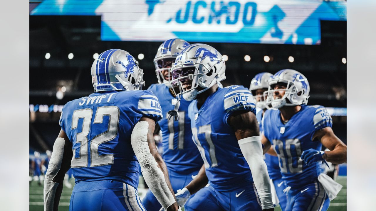 Detroit Lions running back D'Andre Swift celebrates his touchdown run