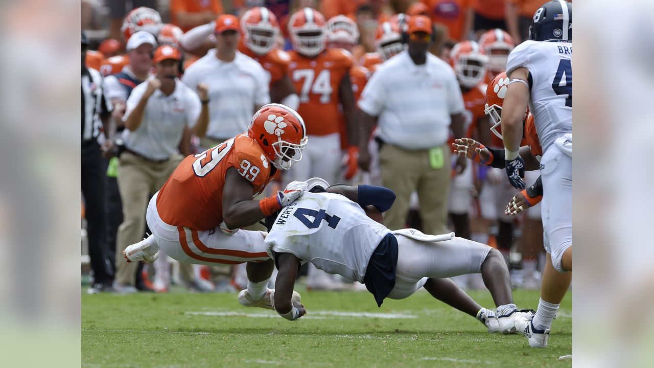 Defensive end Clelin Ferrell (99) grabs some air during a Las