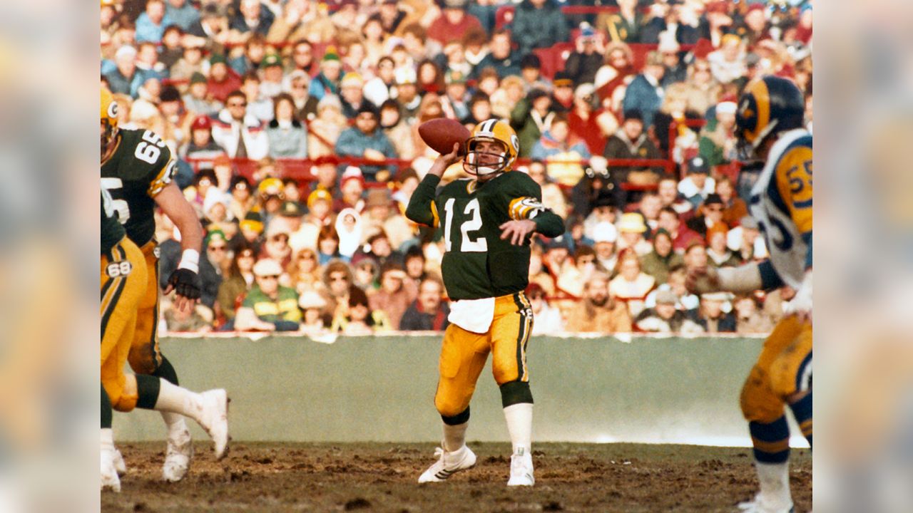 Green Bay Packers quarterback Lynn Dickey hits James Lofton for