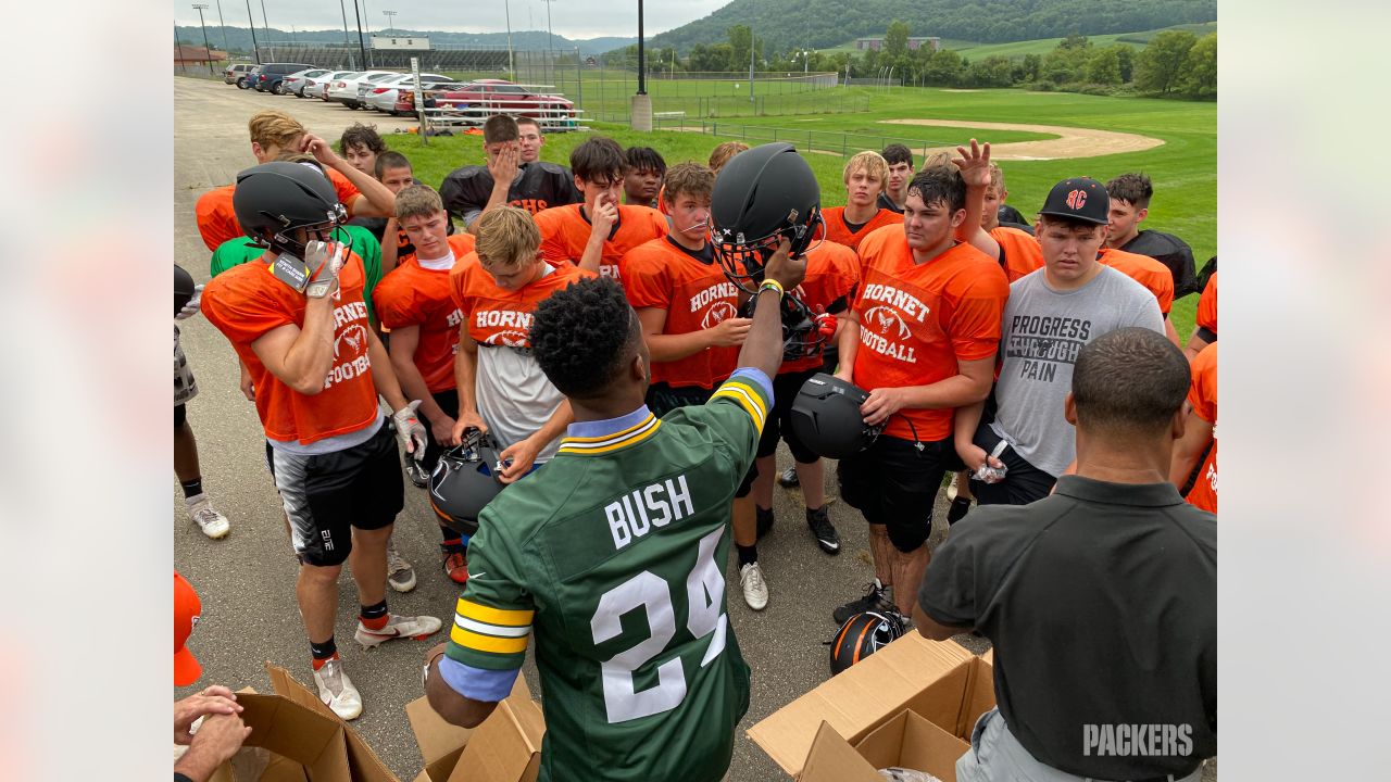 Packers Give Back donates new helmets to four high school football