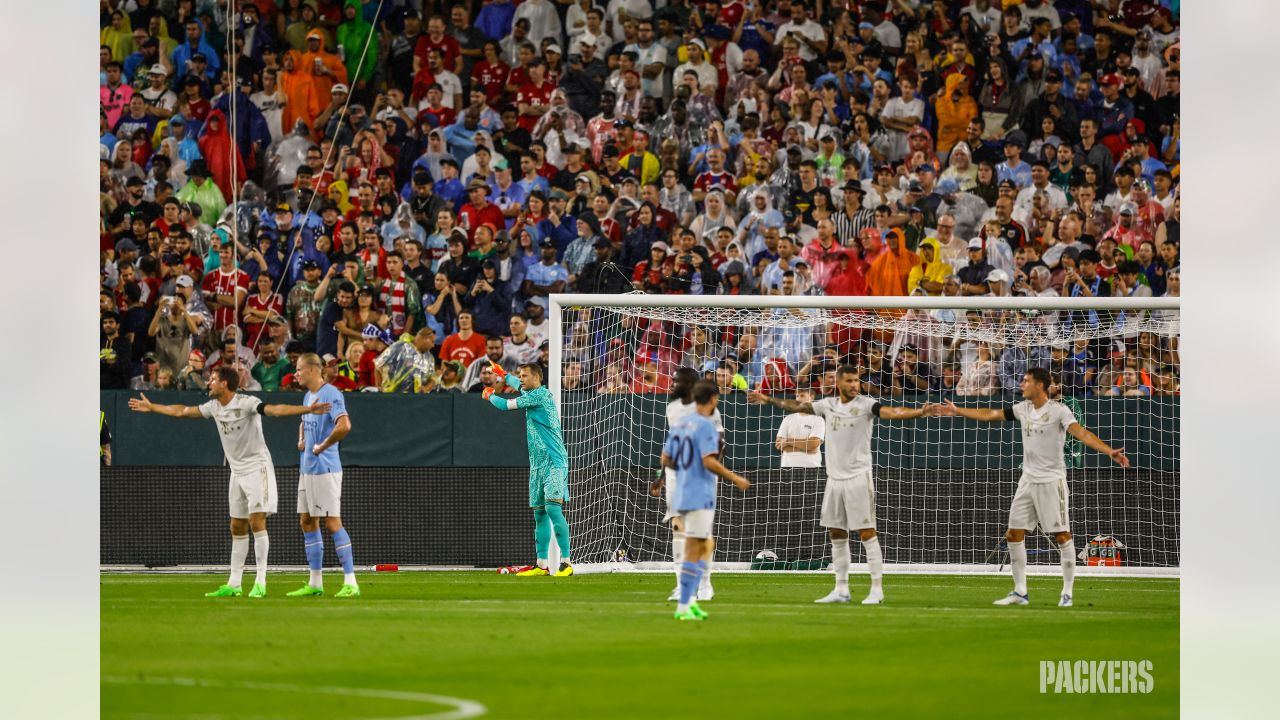 ESPN FC on X: 80,000 fans filled Lambeau Field to watch Man City