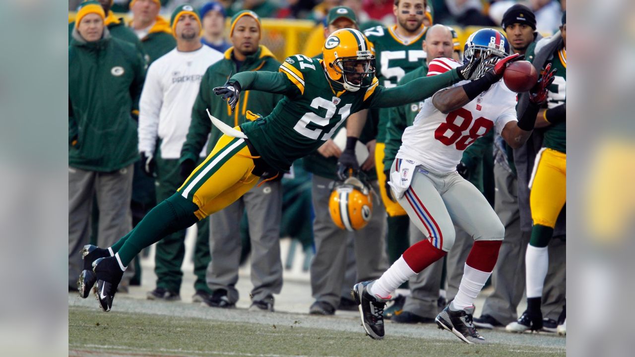 Only two feet short of a touchdown, Green Bay Packers Clarke Hinkle is  shown as he was halted by the New York Giants in the second period of their  championship game with