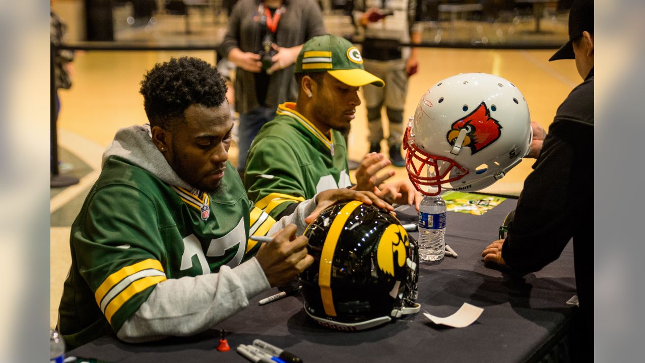 Green Bay Packers' Jaire Alexander signs autographs at the NFL