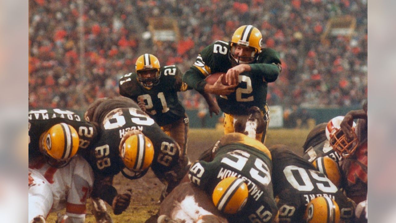 Green Bay quarterback Lynn Dickey listens to head coach Bart Starr