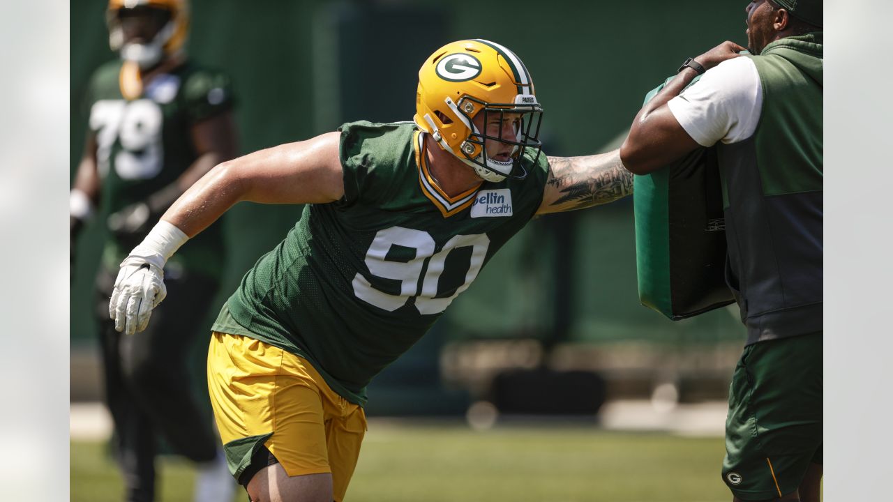 Jack Heflin of the Green Bay Packers walks off the field after the News  Photo - Getty Images