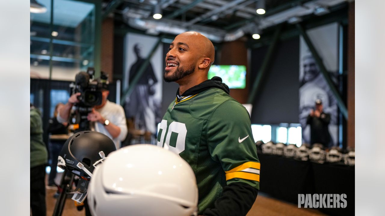 Packers surprise high school football teams with new helmets, visit from AJ  Dillon