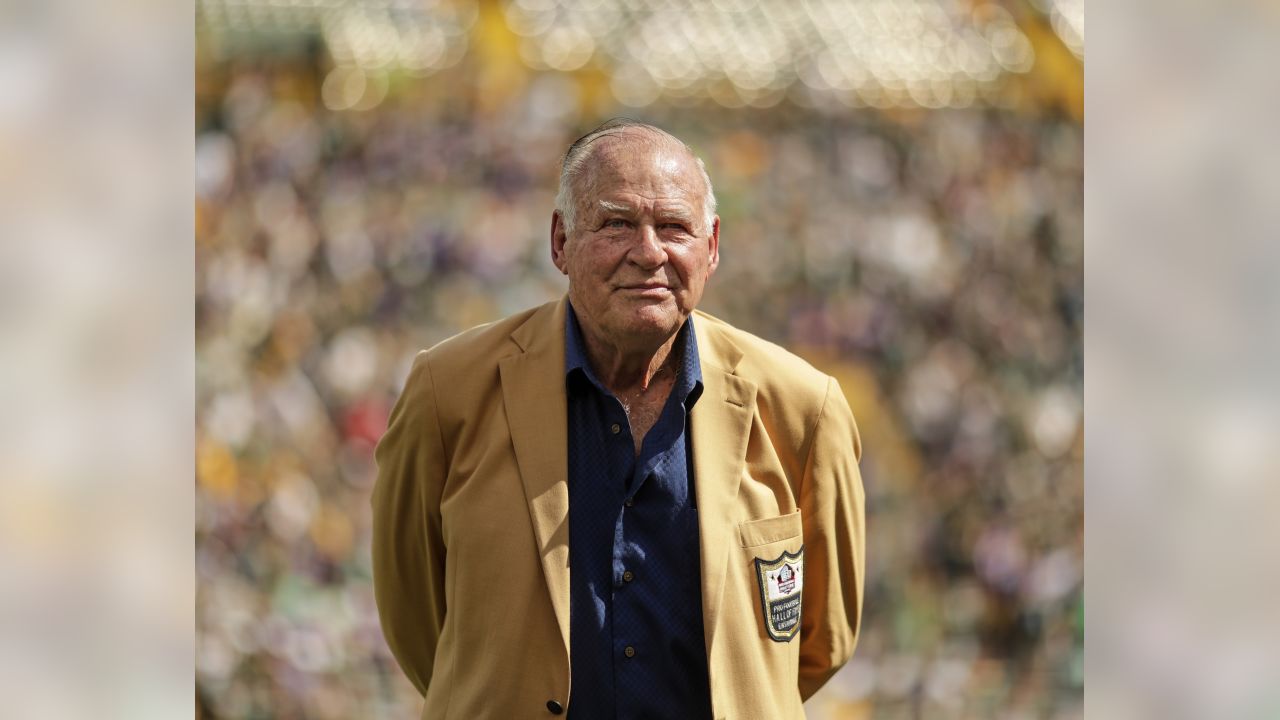 Jerry Kramer stands with his bust after his enshrinement into the