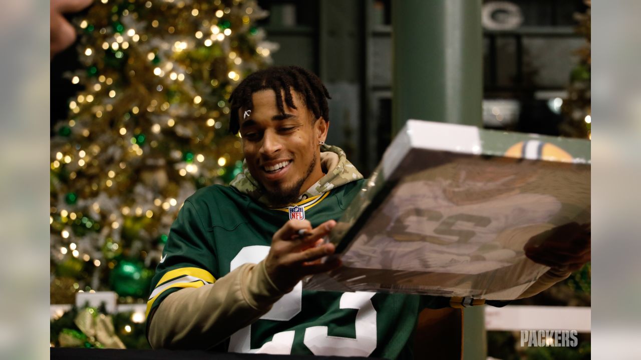 Jamaal Williams, Jaire Alexander & Kenny Clark sign autographs for charity